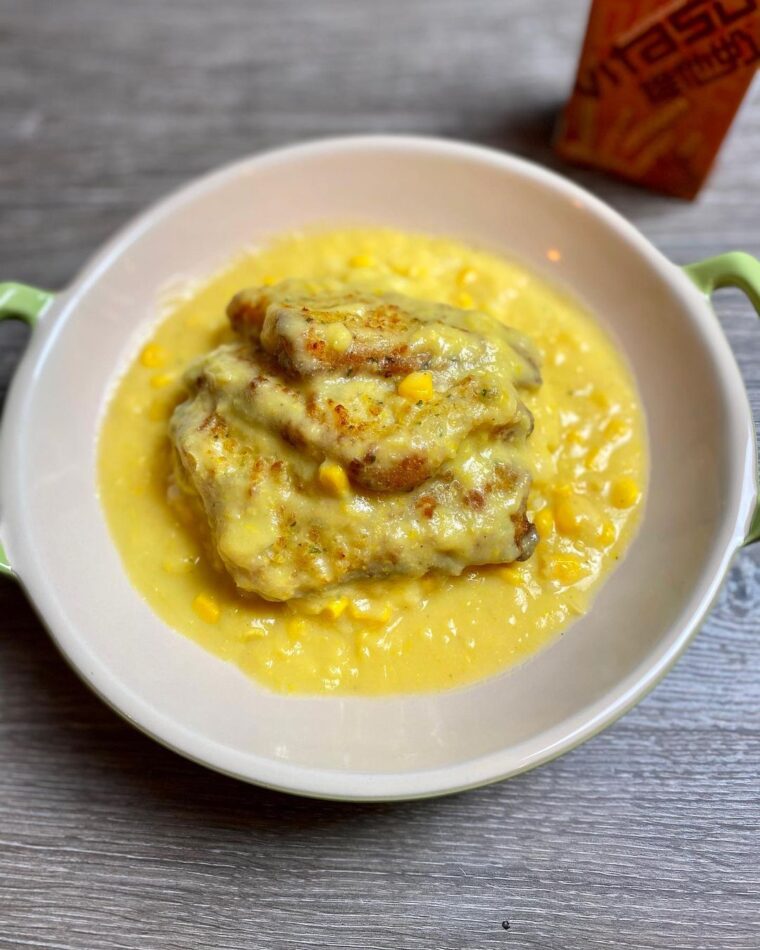 Fried Fish Filet In Creamy Corn Sauce On Rice