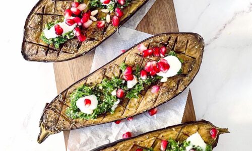 Roasted Eggplants Topped With Lemon Parsley Sauce And Pomegranate Seeds
