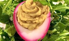 Curried Deviled Egg With A Pickled Beet Dyed Magenta Rim