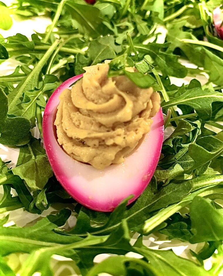 Curried Deviled Egg With A Pickled Beet Dyed Magenta Rim
