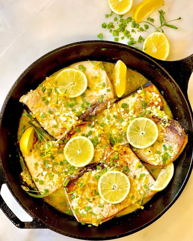 Seared Swordfish Topped With A Savory Lemon And Garlic Sauce