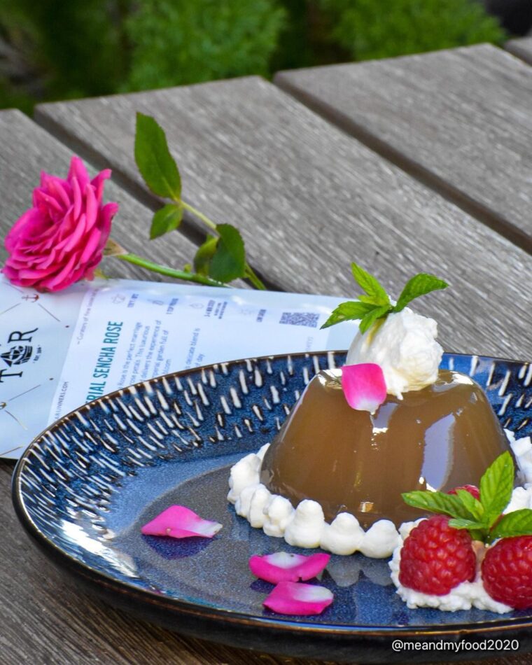 Tea Jelly With Whipped Cream And Fresh Raspberries