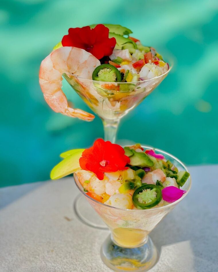 Shrimp & Mango Ceviche Served In A Martini Glass With Cucumber & Tri-color Peppers